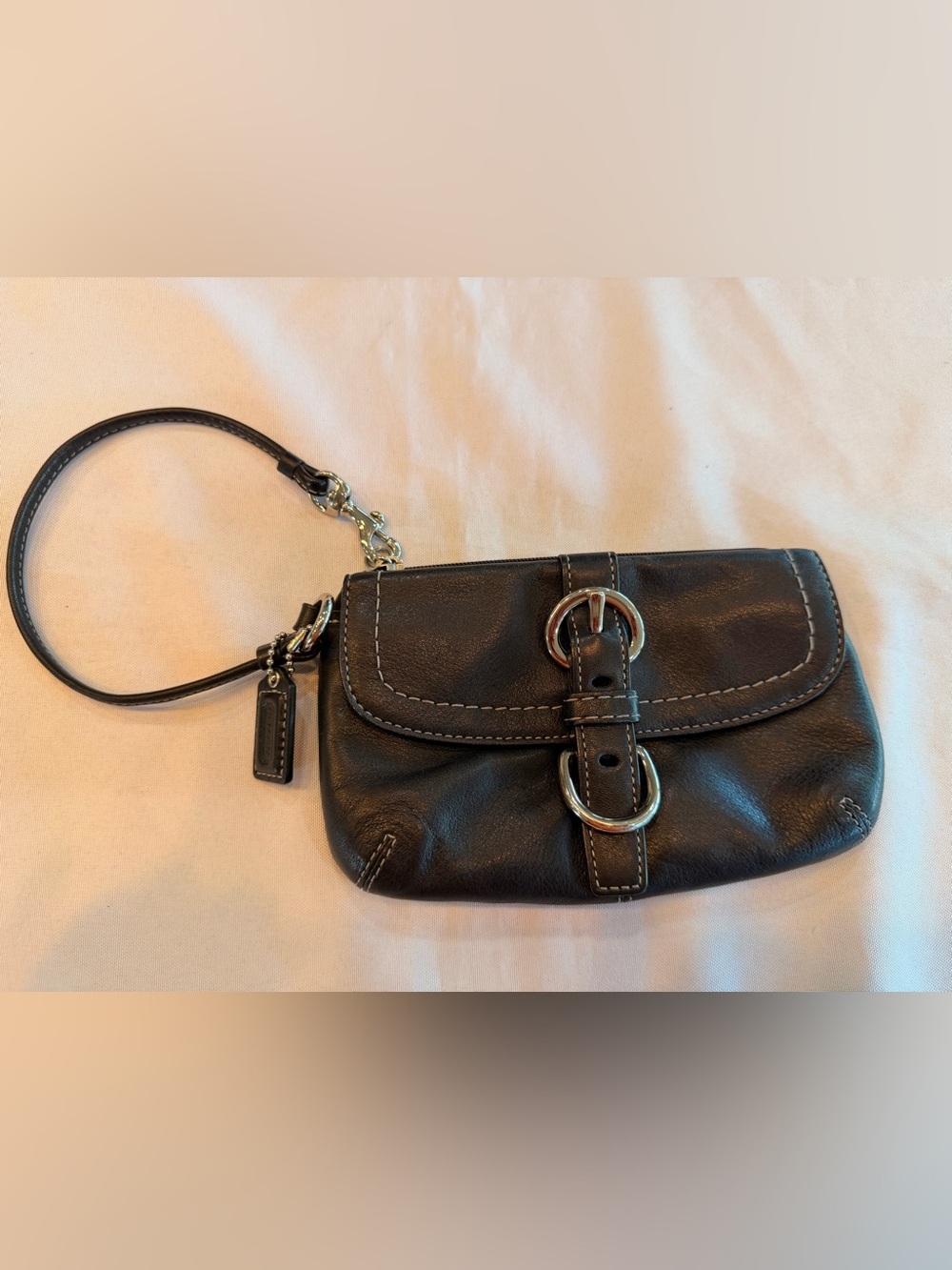 Coach SoHo Black Leather Wristlet with Silver Buckle Flap Closure